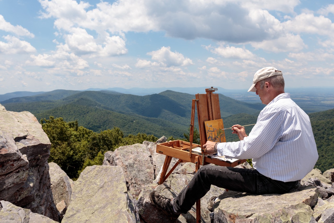 A man paints a gorgeous mountain scene at Shenandoah National Park in Virginia