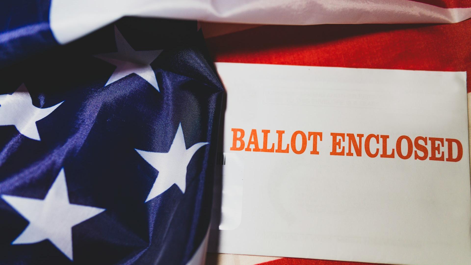 Photo of a paper ballot and American flag