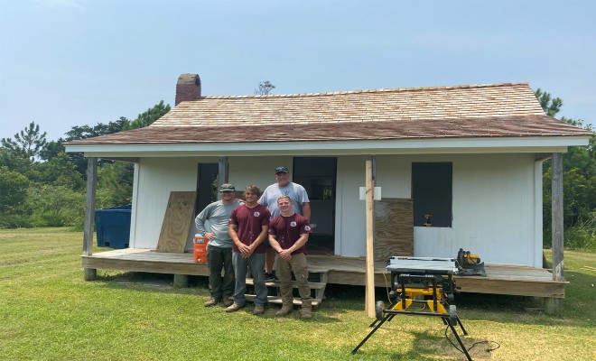  NPS Staff & TTAP Interns pose in front of the house as repairs near completion