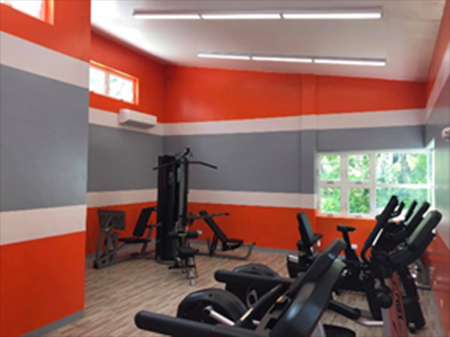 Gym-room-with-exercise-equipment photo