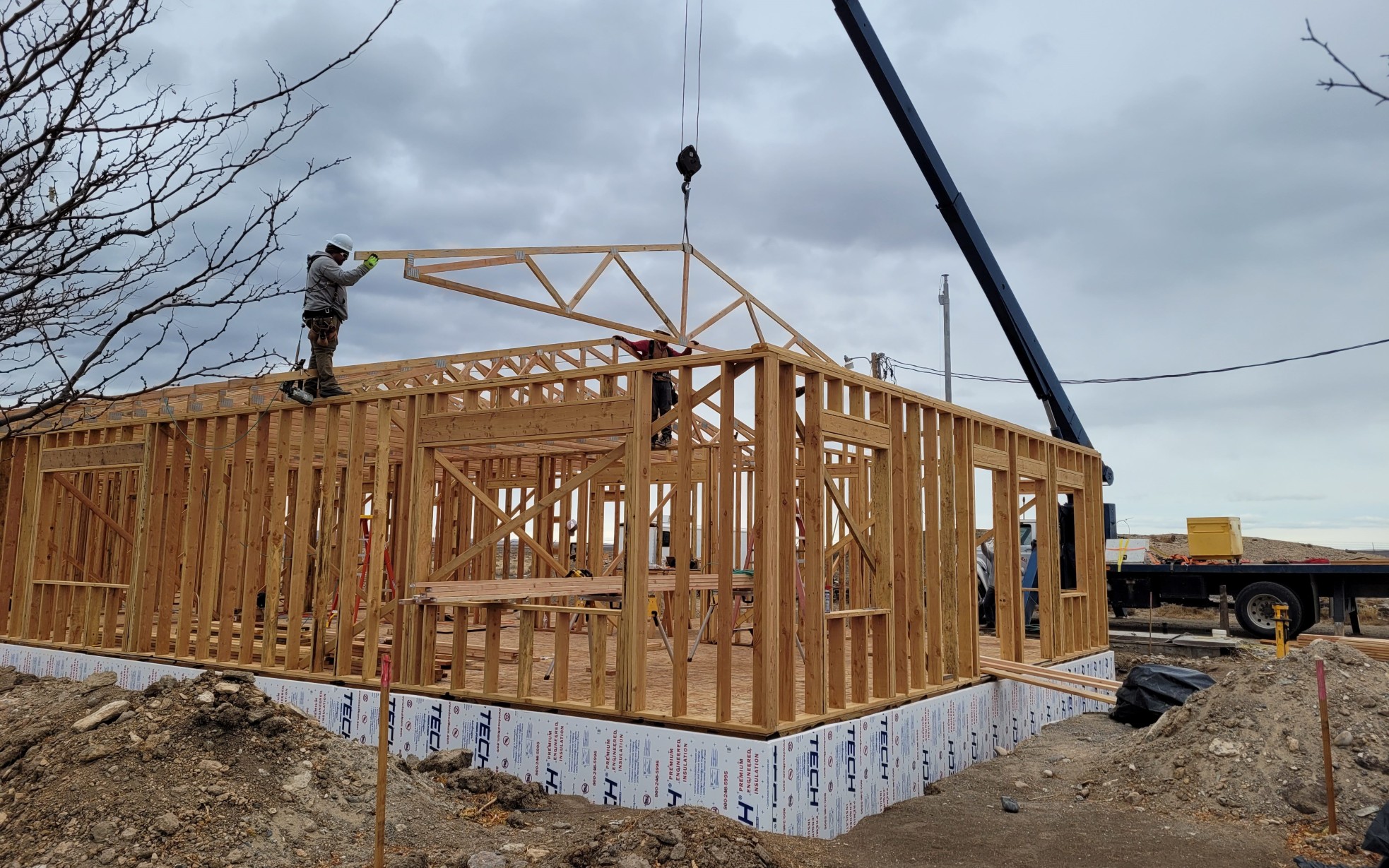 Wooden frame of barracks building under construction.