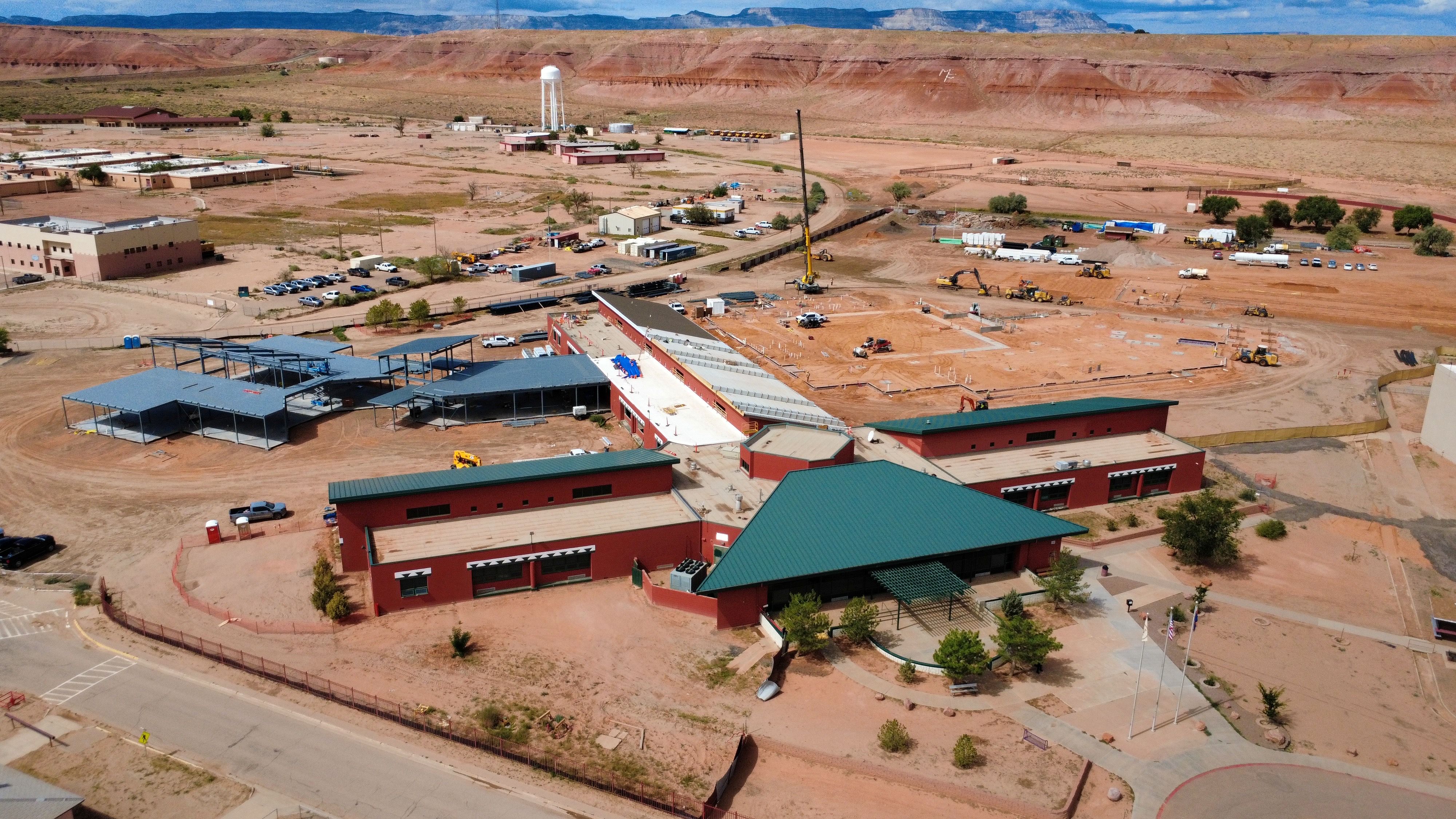 Aerial view of construction site in arid landscape.