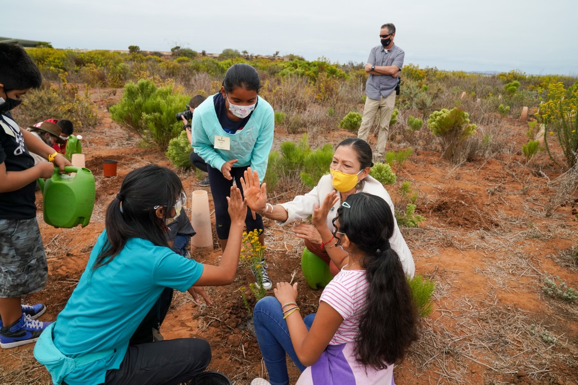 Secretary Haaland and group of youth at San Diego National Wildlife Refuge. 