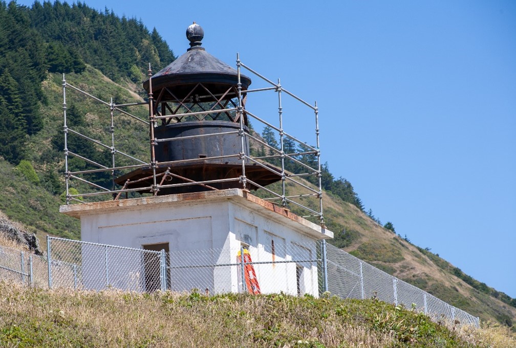 Scaffolding surrounding the Punta Gorda Lighthouse on a hill.