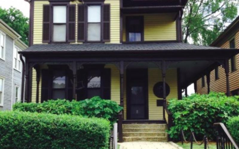 Martin Luther King, Jr.'s birth home is a two story wooden house with a side porch and shutters and a small front yard.