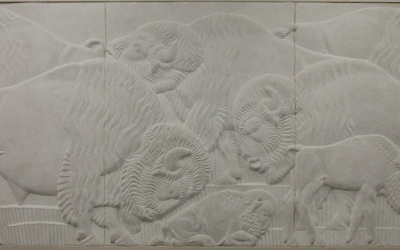 Bas relief panel of Missouri marble depicting a herd of bison