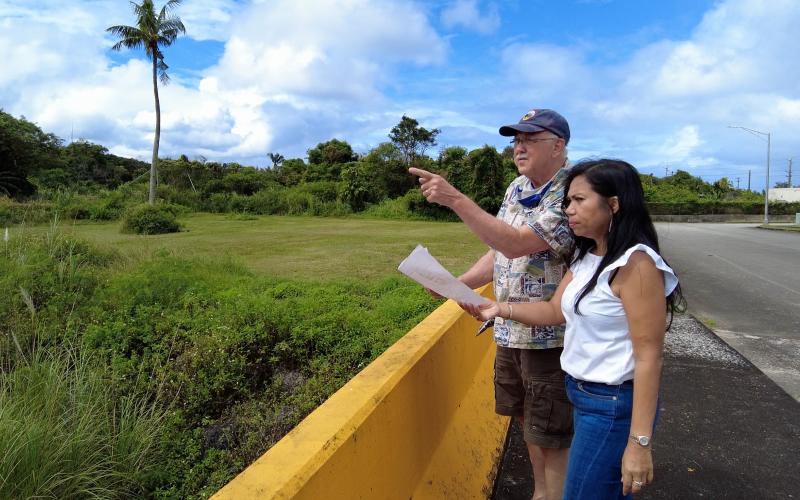 Appraisers at a property in a lush, green area in Guam
