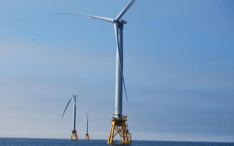 Wind turbines in ocean water.