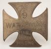 Cross-shaped, metal Watchman's badge