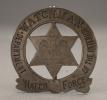 Pin-style badge with a six-pointed star, eagle, and the words, "Department of the Interior Watch Force Watchman"
