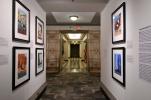 View of the "POSTERity" exhibition with interpretive panels and six framed serigraphs visible.