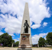 Bunker Hill Monument and a statue of Colonel William Prescott in Charlestown, Massachusetts