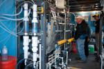 Group of people in a desalination facility. 