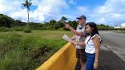 Appraisers at a property in a lush, green area in Guam