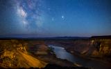 The deep canyon of the Snake River under a starry sky.