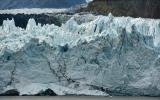 Icy blue glaciers at the water front