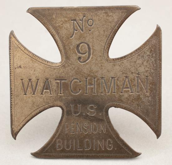 Cross-shaped, metal Watchman's badge
