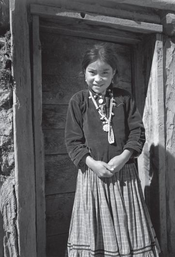 Black and white photograph by Ansel Adams of a Navajo girl