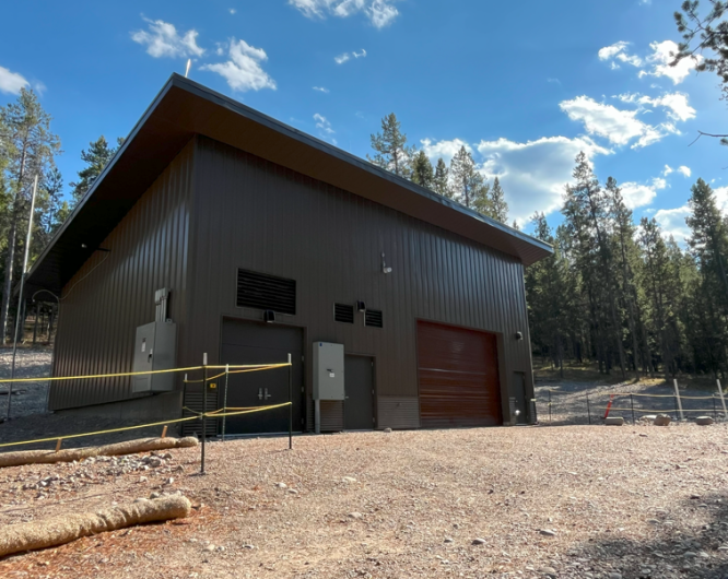 New wastewater lift station building with brown siding.