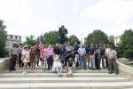 Group of people with 250 flag in front of Sheridan Fountain Ribbon Cutting