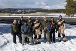 Yellowstone staff with Sec Doug Burgum holding 250 flag