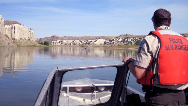 USFW BLM Ranger on patrol boat 