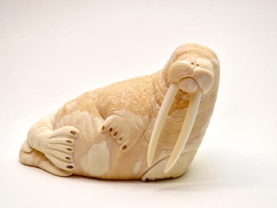 An ivory carving entitled "Ayveq (Walrus)" by Ben Pungowiyi, St. Lawrence Island Yupik © 2019