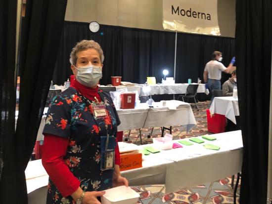 Nurse Hayden stands inside the Wisconsin Center to assisting the vaccination clinic. 