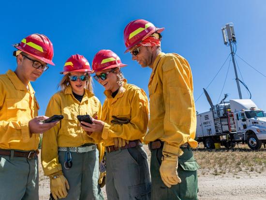Firefighters on the 2019 Vader Fire connect with essential mobile applications through a FirstNet broadband connection.