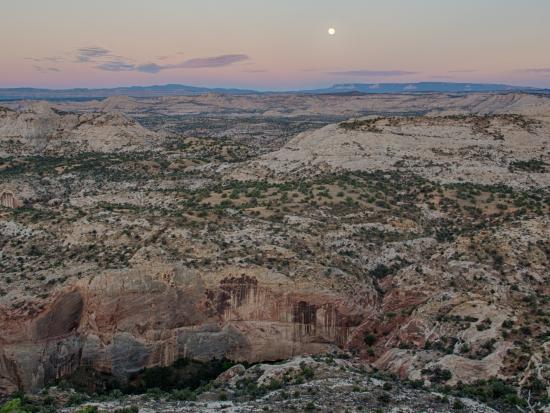 Sunset over the vast and austere landscape of the Grand Staircase-Escalante National Monument.
