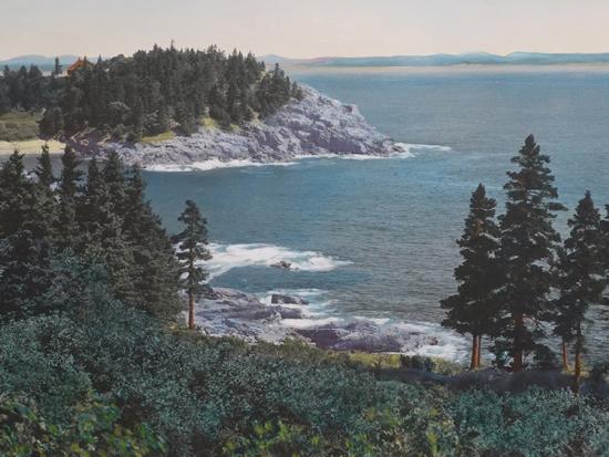 Hand-tinted photograph of Schooner Head peninsula at Acadia National Park, with trees and Atlantic Ocean.