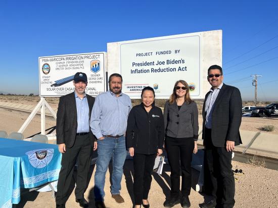 nterior Department leaders stand in front of project construction signs following a celebration event to announce $5.65 million for the Gila River Indian Community to construct and install solar panels over the Casa Blanca Canal.