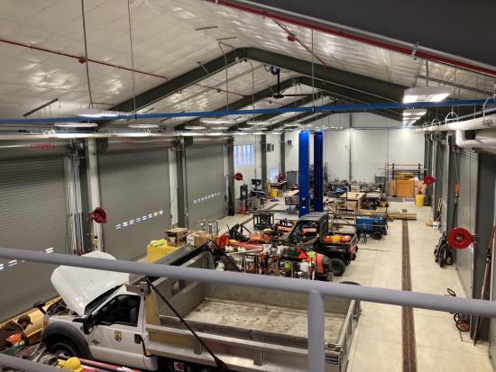 Garage with trucks and works tools