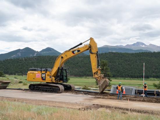 Digging a trench to lay down new water lines along Moraine Park Road
