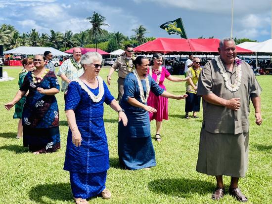 Group of people participating in traditional celebration ceremony