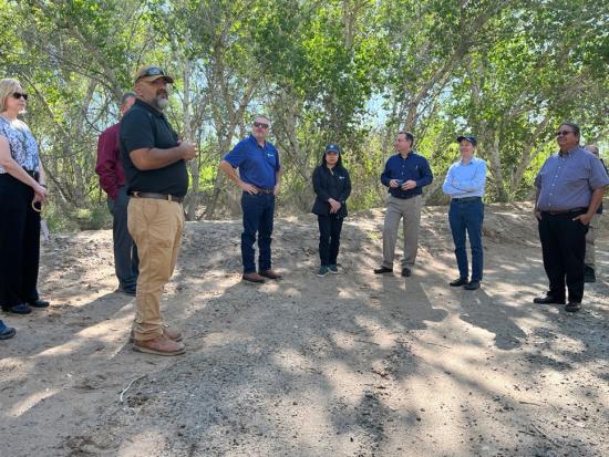 Group of people and Department Leadership standing outdoors.