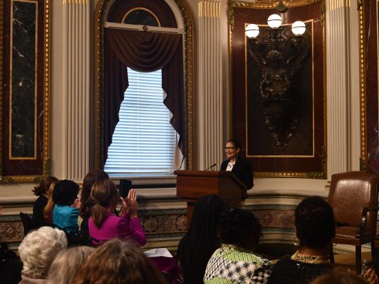 Secretary Haaland speaking behind podium at the White House