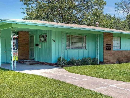 Seafoam green one-story house