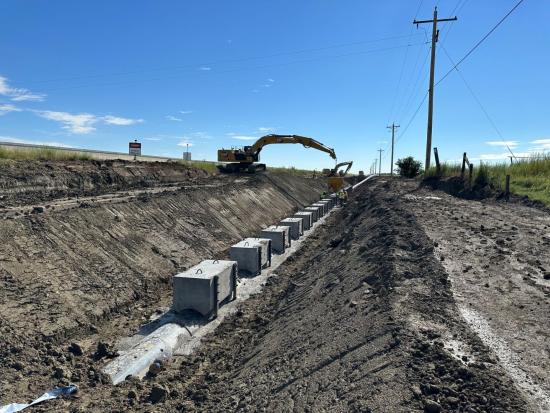 Construction of ditch for water storage project.