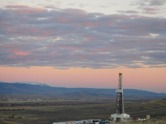 Oil and gas mining operation at dusk. 