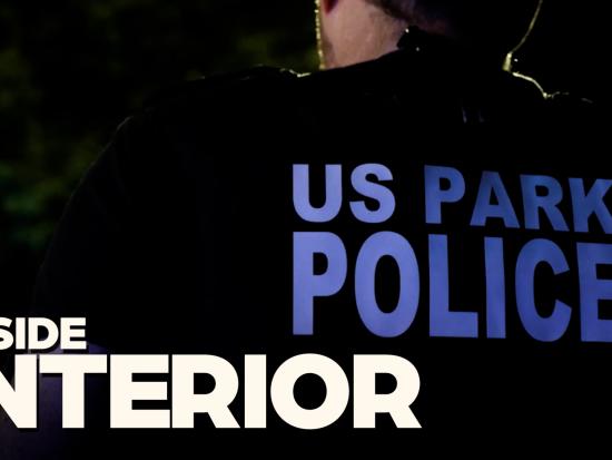 US Park Police is seen on an officer's vest at night