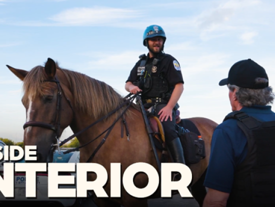 Park police on mounted patrol next to Secretary Burgum