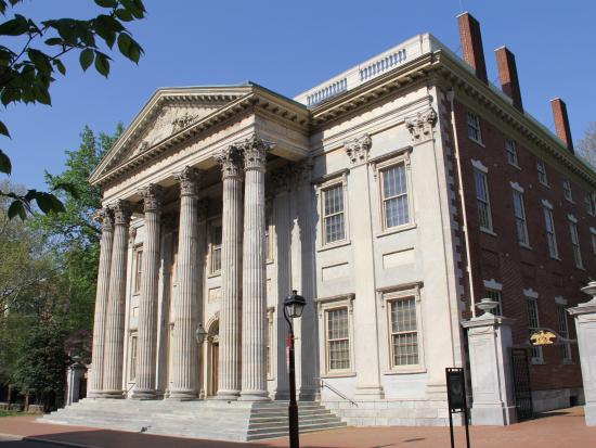 White marble two-story building with six columns