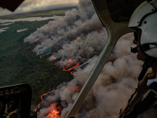 National Park Service fire and aviation management personnel monitor a prescribed fire in Florida from the air.