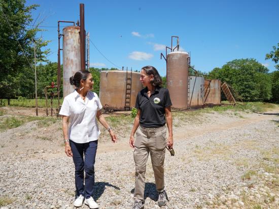 Secretary of the Interior Deb Haaland and Senior Advisor Winnie Stachelberg tour an orphan well in Deep Fork