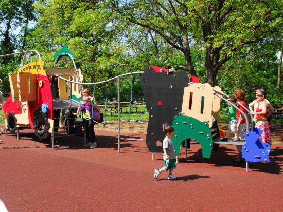 A playground structure at Glen Echo Park in Maryland with several children playing on it.