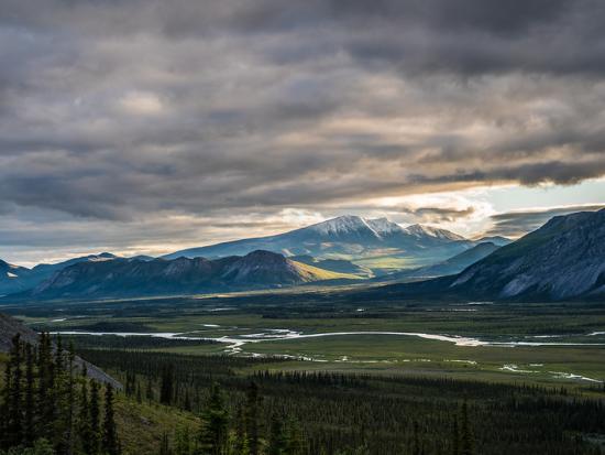 Soft light over snow-capped mountains at Arctic Refuge.