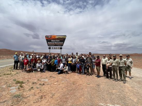 Participants standing in front of the newly installed Bears Ears National Monument sign
