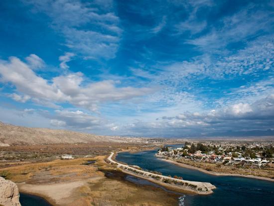 The shores of the Colorado River against a bright blue sky