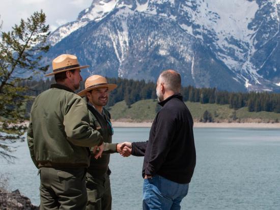 Deputy Secretary Beaudreau shakes the hand of a park ranger in Yellowstone National Park
